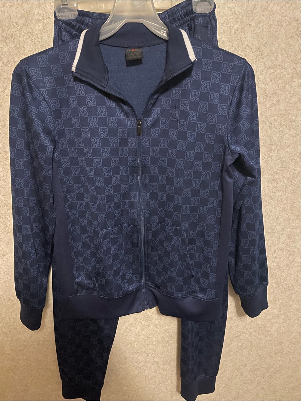 Jordan Navy Tracksuit Jacket with Jumpman Logo and matching joggers.